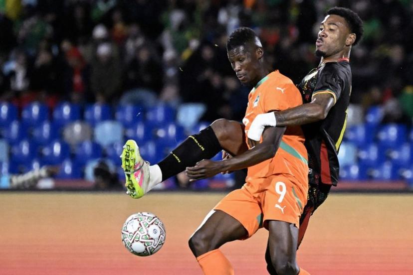 Ivory Coast's forward #09 Vakoun Bayo (2nd R) fights for the ball with Ivory Coast's forward #15 Amad Diallo (R) during the Africa Cup of Nations (CAN) Group F football match between Ivory Coast and Cameroon at Marrakesh Stadium in Marrakesh on December 28, 2025.   Khaled DESOUKI / AFP