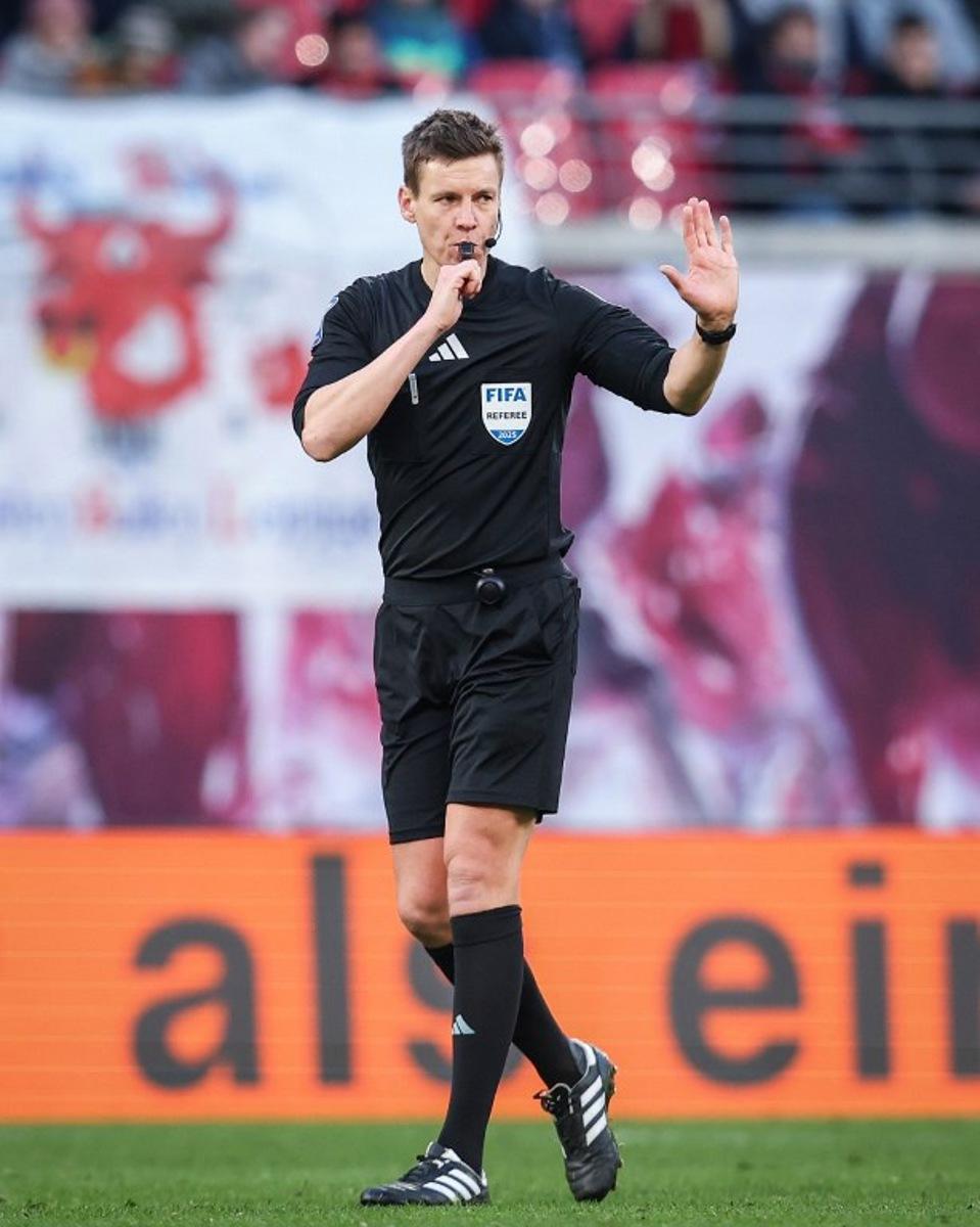 German referee Daniel Siebert reacts during the German first division Bundesliga football match between RB Leipzig and 1 FSV Mainz 05 in Leipzig, eastern Germany on March 1, 2025.  Ronny Hartmann / AFP