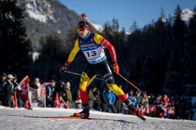 Belgium Florent Claude #13 competes in the men's 12,5 km pursuit event of the IBU Biathlon World Cup in Lenzerheide on December 16, 2023.  Fabrice COFFRINI / AFP