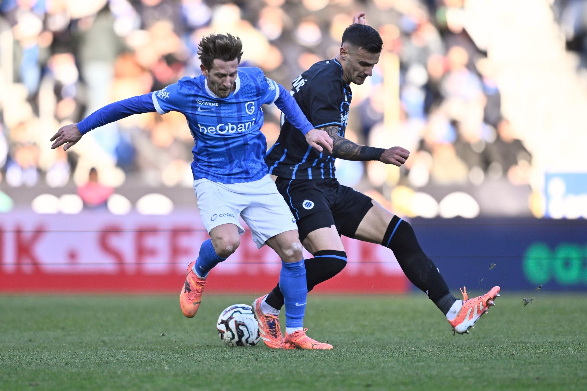 Genk's Patrik Hrosovsky and Club's Aleksandar Stankovic fight for the ball during a soccer match between KRC Genk and Club Brugge, Friday 26 December 2025 in Genk, a game of day 20 of the 2025-2026 'Jupiler Pro League' first division of the Belgian championship. BELGA PHOTO JOHAN EYCKENS