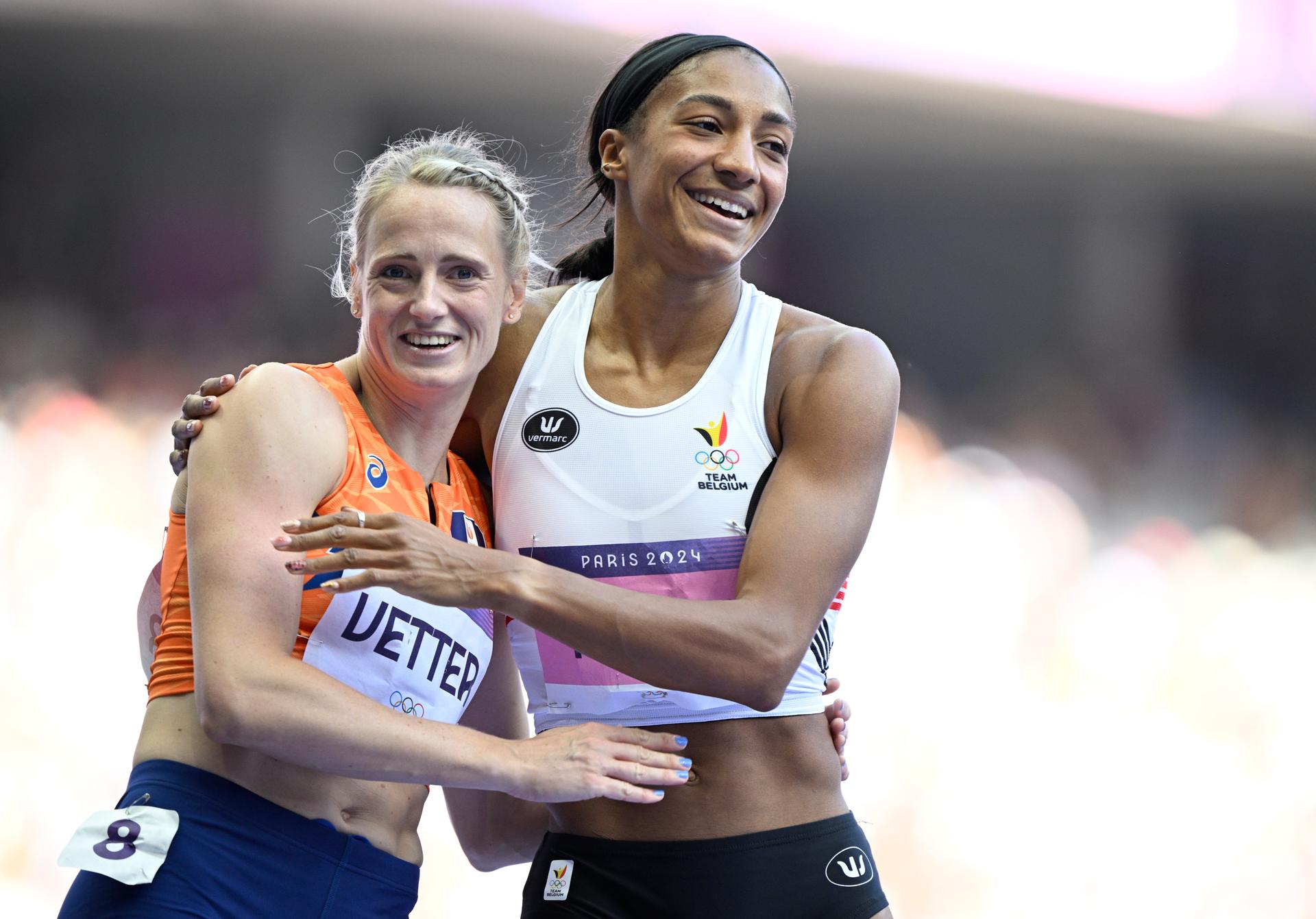 Dutch Anouk Vetter and Belgian athlete Nafissatou Nafi Thiam react after the 100m hurdles race, the first event of the women's heptathlon competition at the athletics event at the Paris 2024 Olympic Games, on Thursday 08 August 2024 in Paris, France. The Games of the XXXIII Olympiad are taking place in Paris from 26 July to 11 August. The Belgian delegation counts 165 athletes competing in 21 sports. BELGA PHOTO JASPER JACOBS