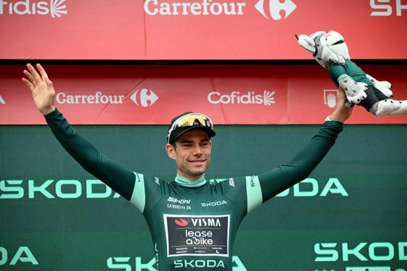 Team Visma-Lease a bike's Belgian rider Wout van Aert celebrates on the podium wearing the points ranking leader's green jersey after the 11th stage of the Vuelta a Espana 2026 cycling tour, a 151,3 km race between Carthagena and Lorca, on September 2, 2026.  JOSE JORDAN / AFP
