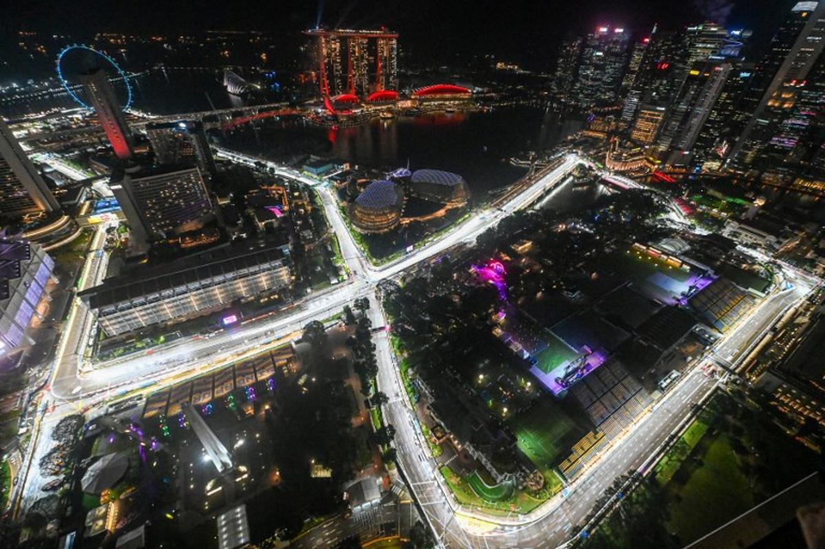 This photo shows the road circuit illuminated for the the upcoming Formula One Singapore Grand Prix at the Marina Bay Street Circuit in Singapore on October 1, 2025.  Roslan RAHMAN / AFP
