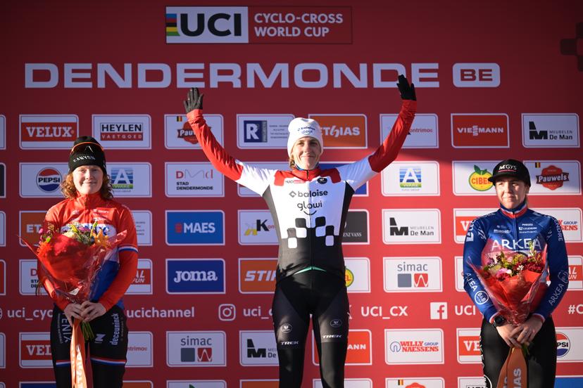 L-R, second Dutch Puck Pieterse, winner Dutch Lucinda Brand and third French Amandine Fouquenet celebrate on the podium at the women's elite race at the World Cup cyclocross cycling event in Dendermonde, Belgium, stage 8 (out of 12) of the UCI World Cup cyclocross competition, Sunday 28 December 2025. BELGA PHOTO DAVID PINTENS