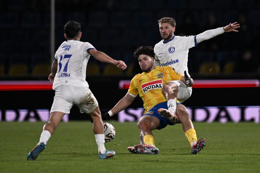 Westerlo's Nacho Ferri and Gent's Siebe Van der Heyden fight for the ball during a soccer match between KVC Westerlo and KAA Gent, Saturday 22 November 2025 in Westerlo, on day 15 of the 2025-2026 'Jupiler Pro League' first division of the Belgian championship. BELGA PHOTO JOHAN EYCKENS