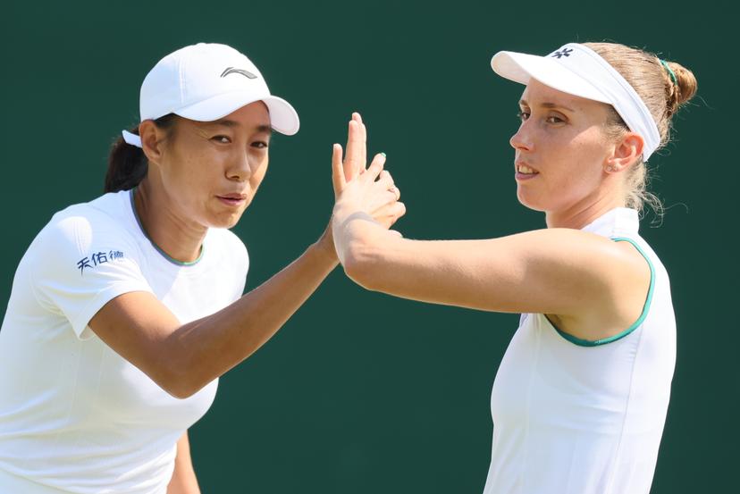 Chinese Tianhui Zhang and Belgian Elise Mertens pictured during a doubles tennis match between Romanian pair Cristian-Begu and Belgian-Chinese pair Mertens-Zhang, in the first round of the Women's doubles at the Wimbledon grand slam tennis tournament in London, Britain, Friday 03 July 2026.  BELGA PHOTO BENOIT DOPPAGNE