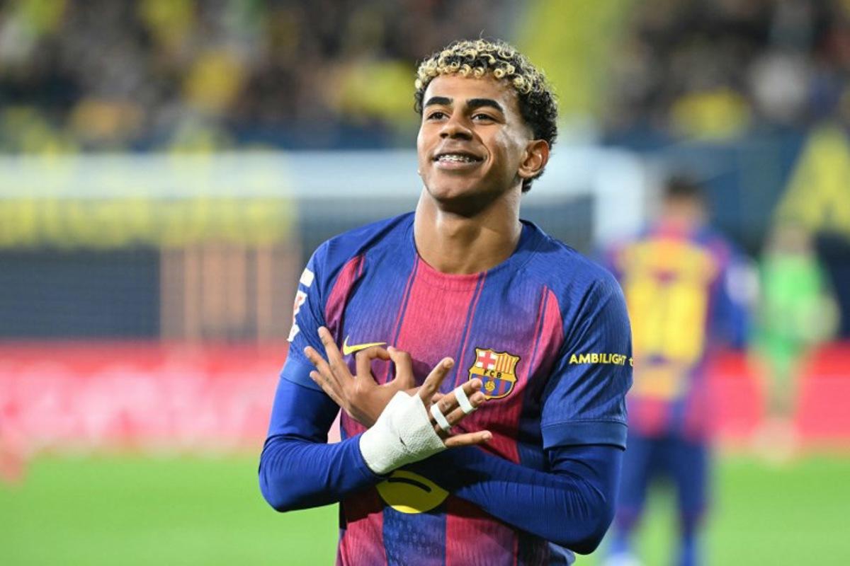 Barcelona's Spanish forward #10 Lamine Yamal celebrates scoring his team's second goal during the Spanish league football match between Villarreal CF and FC Barcelona at La Ceramica Stadium in Vila-real on December 21, 2025.  JOSE JORDAN / AFP