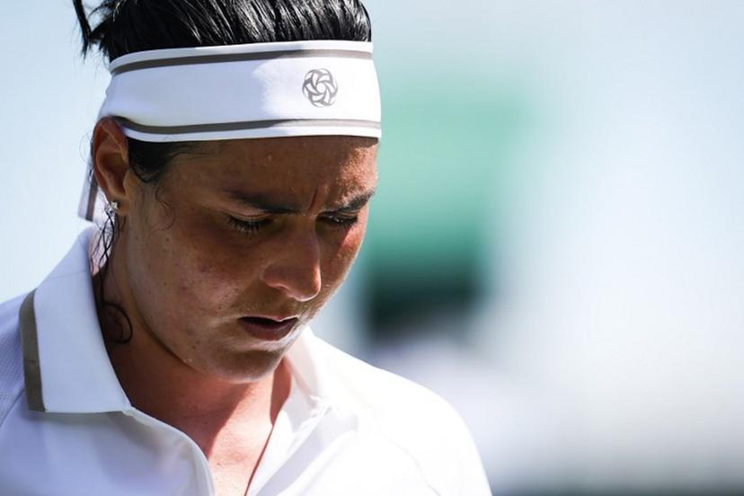 Tunisia's Ons Jabeur reacts as she plays against Bulgaria's Viktoriya Tomova during their women's singles first round tennis match on the first day of the 2025 Wimbledon Championships at The All England Lawn Tennis and Croquet Club in Wimbledon, southwest London, on June 30, 2025.  HENRY NICHOLLS / AFP