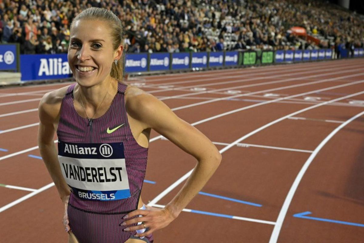 Belgium's Elise Vanderelst celebrates after breaking the Belgian record in the Women's 1500m final of the Memorial Van Damme Diamond League athletics finals at the Roi Baudouin Stadium in Brussels on September 14, 2024.  NICOLAS TUCAT / AFP