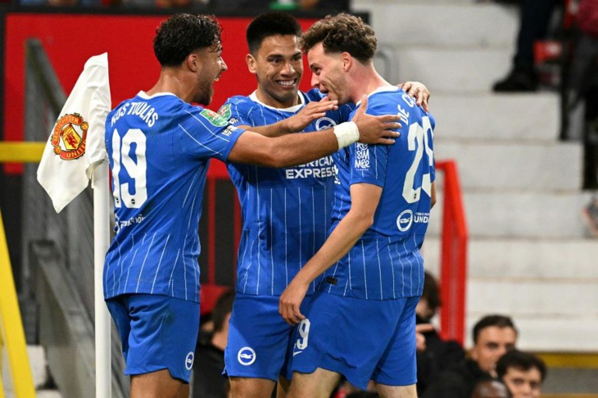 Brighton's Belgian defender #29 Maxim De Cuyper (R) celebrates scoring the team's third goal during the English League Cup third round football match between Manchester United and Brighton and Hove Albion at Old Trafford in Manchester, north west England, on September 16, 2026.  Oli SCARFF / AFP