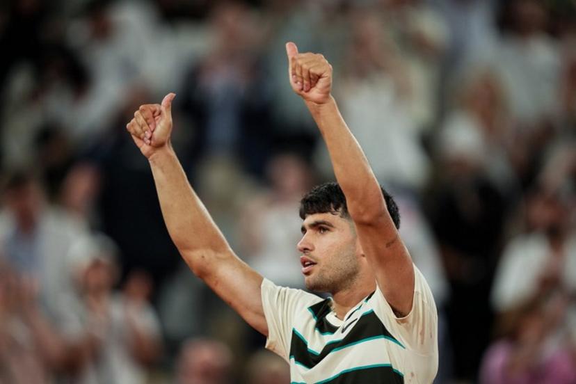 Spain's Carlos Alcaraz celebrates after winning his men's singles match against Bosnia and Herzegovina's Damir Dzumhur on day 6 of the French Open tennis tournament on Court Philippe-Chatrier at the Roland-Garros Complex in Paris on May 30, 2025.  Dimitar DILKOFF / AFP