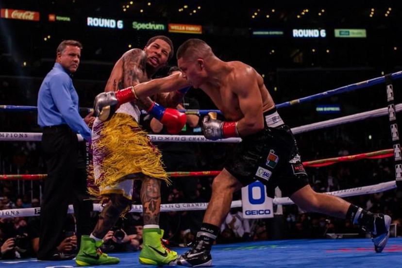 US boxer Gervonta Davis (L) fights Mexican boxer Isaac Cruz during their WBA Lightweight Championship bout at the Staples center in Los Angeles, California on December 5, 2021.   Apu GOMES / AFP