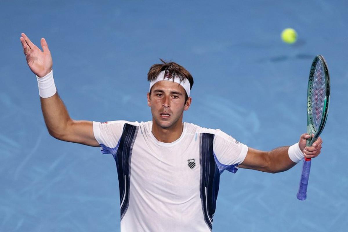 Argentina's Tomas Martin Etcheverry reacts on a point to Kazakhstan's Alexander Bublik during their men's singles match on day six of the Australian Open tennis tournament in Melbourne on January 23, 2026.  IZHAR KHAN / AFP