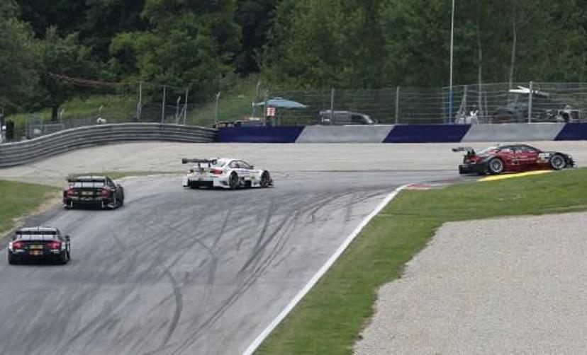 Italy's Edoardo Mortara (R) of Audi Sport Team Rosberg, Britain's Gary Paffett (2nd L) of Thomas Sabo Mercedes AMG team and Germany's Martin Tomczyk (2nd R) of BMW team RMG compete on June 3, 2012 during the fourth race of the season of the DTM Championship, the German touring car masters, in Spielberg . Mortara won the race. AFP PHOTO / ALEXANDER KLEIN