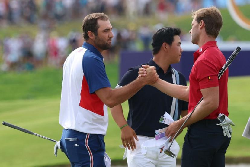 (From L) US' Scottie Scheffler, South Korea's Kim Jooh-yung and Belgium's Thomas Detry greet each other after completing the course in round 4 of the men's golf individual stroke play of the Paris 2024 Olympic Games at Le Golf National in Guyancourt, south-west of Paris on August 4, 2024.   Emmanuel DUNAND / AFP