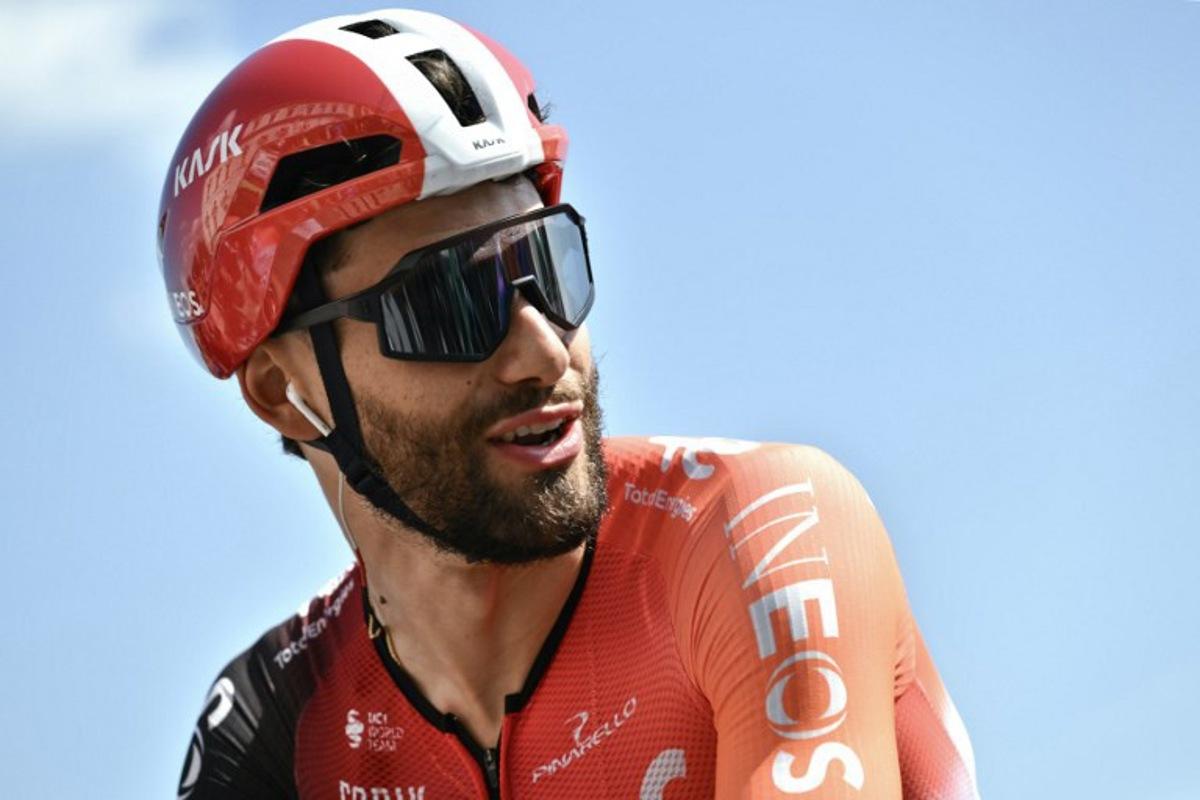 Team Ineos' Italian rider Filippo Ganna arrives to compete in the first stage of the Vuelta a Espana, a 183 km race between Torino - Reggia di Venaria and Novara, in Italy's Piemonte region, on August 23, 2025.    Marco BERTORELLO / AFP