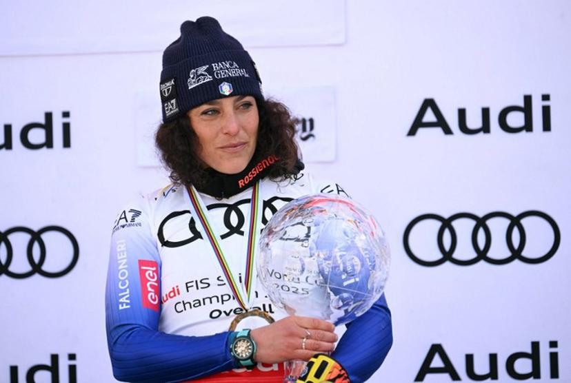 Women's overall winner Federica Brignone celebrates on the podium at the 2025 FIS Alpine World Cup Finals at Sun Valley Resort in Sun Valley, Idaho, on March 27, 2025.  Patrick T. Fallon / AFP