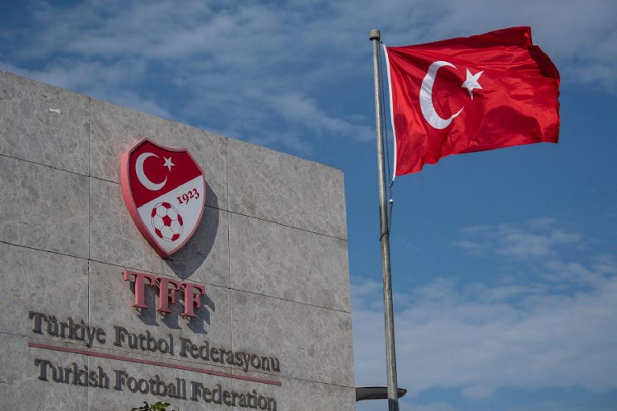 (FILES) This picture taken on May 6, 2020 in Istanbul shows a logo of Turkish Football Federation (TFF) at the entrance of the organization's headquarters. The head of Turkey's football refereeing body and six others were to appear in court on October 2, 2026, three days after being detained as part of a graft investigation, media reports said. Ferhat Gundogdu and his vice-president were detained alongside five others on Tuesday as part of a probe into allegations of top-level manipulation of the referee administration process.  Ozan KOSE / AFP