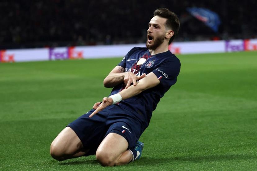Paris Saint-Germain's Georgian forward #07 Khvicha Kvaratskhelia celebrates scoring his team's second goal during the UEFA Champions League quarter-final first leg football match between Paris Saint-Germain (PSG) and Liverpool FC at the Parc des Princes stadium in Paris on April 8, 2026.  Anne-Christine POUJOULAT / AFP
