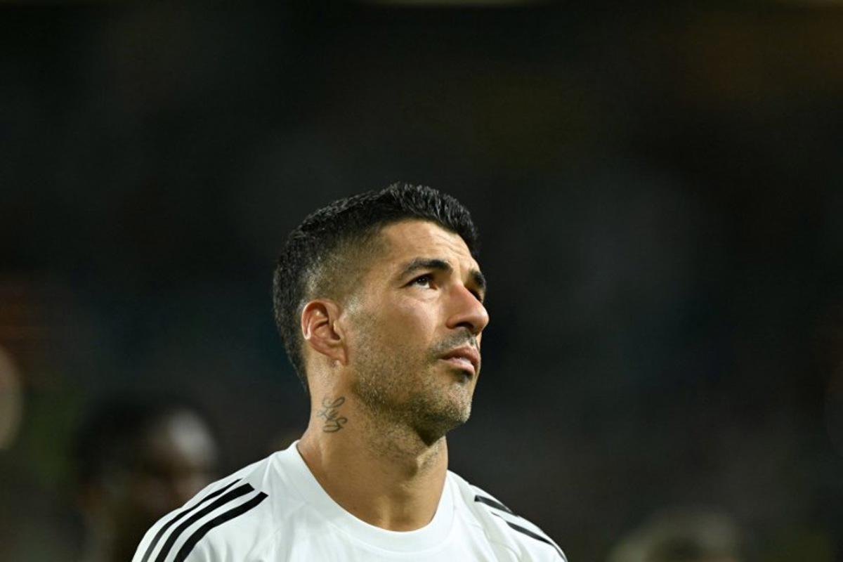 (FILES) Inter Miami's Uruguayan forward #09 Luis Suarez reacts at the end of the FIFA Club World Cup 2025 Group A football match between US Inter Miami and Brazil's Palmeiras at the Hard Rock stadium in Miami on June 23, 2025. Inter Miami star Luis Suarez has been handed a six-match suspension for his actions following this stormy Leagues Cup final defeat to the Seattle Sounders, tournament disciplinary chiefs said on September 5, 2025. The 38-year-old former Uruguay, Liverpool and Barcelona star was sanctioned for spitting at a Sounders official after becoming embroiled in a melee following Miami's 3-0 loss. PATRICIA DE MELO MOREIRA / AFP