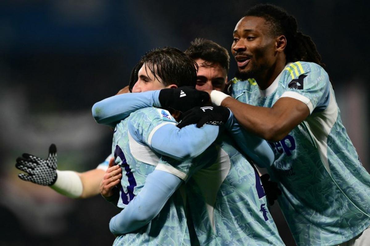 Juventus' Italian midfielder #21 Fabio Miretti celebrates with teammates after scoring his team's second goalduring the Italian Serie A football match between Sassuolo and Juventus at the Mapei - Città del Tricolore stadium in Reggio Emilia, on January 6, 2026.  Marco BERTORELLO / AFP