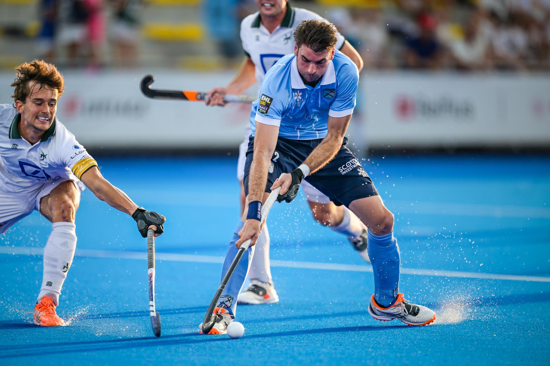 WatDucks' Maxime Van Oost and Braxgata's Marc Reyne fight for the ball during a hockey game between Braxgata and Waterloo Ducks, Sunday 24 May 2026 in Wavre, the return leg of the men's Finals of the Belgian first division hockey championship. BELGA PHOTO DAVID PINTENS