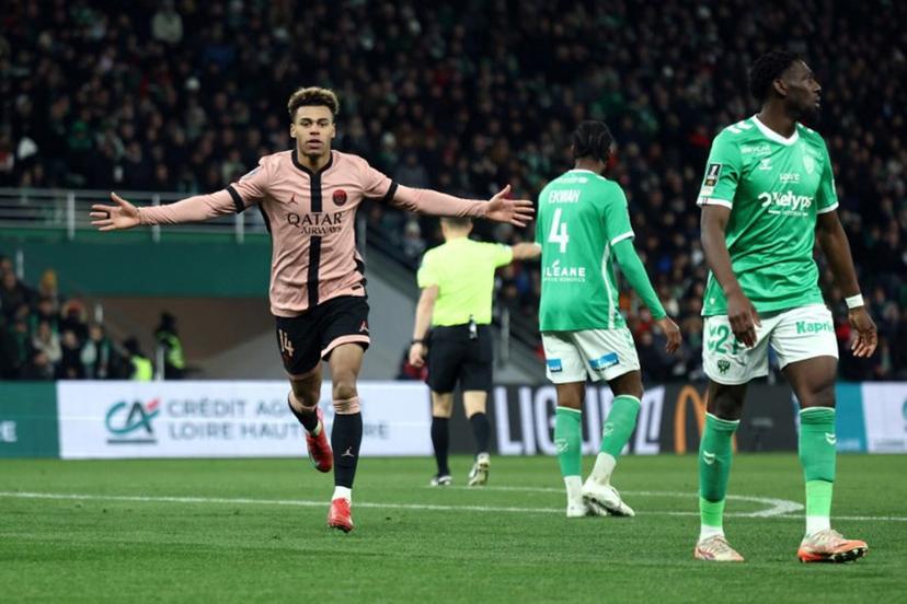 Paris Saint-Germain's French midfielder #14 Desire Doue celebrates scoring his team's third goal during the French L1 football match between AS Saint-Etienne and Paris Saint-Germain (PSG) at the Geoffroy-Guichard stadium in Saint-Etienne, central France on March 29, 2025.  Alex MARTIN / AFP