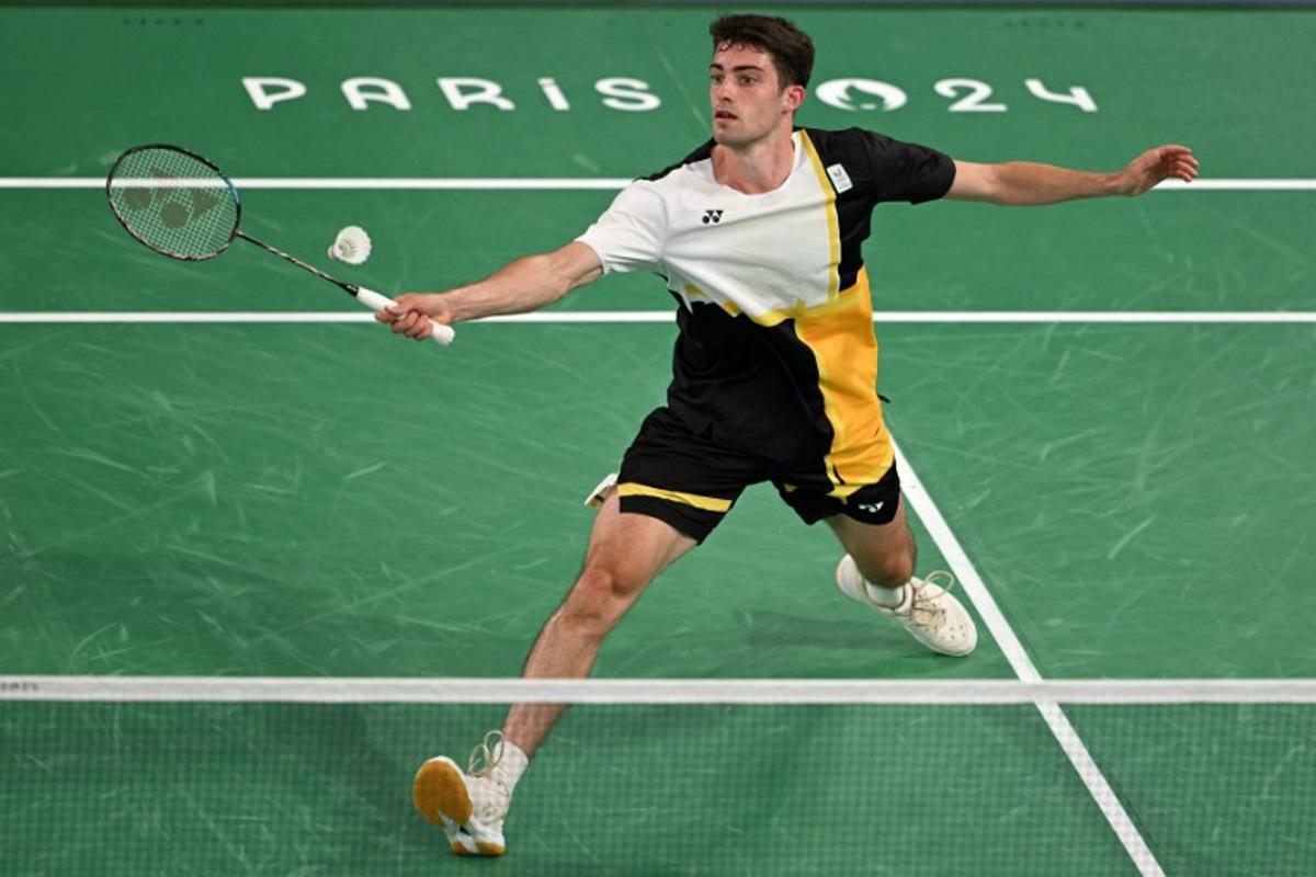 Belgium's Julien Carraggi plays a shot against India's Lakshya Sen in their men's singles badminton group stage match during the Paris 2024 Olympic Games at Porte de la Chapelle Arena in Paris on July 29, 2024.  Arun SANKAR / AFP