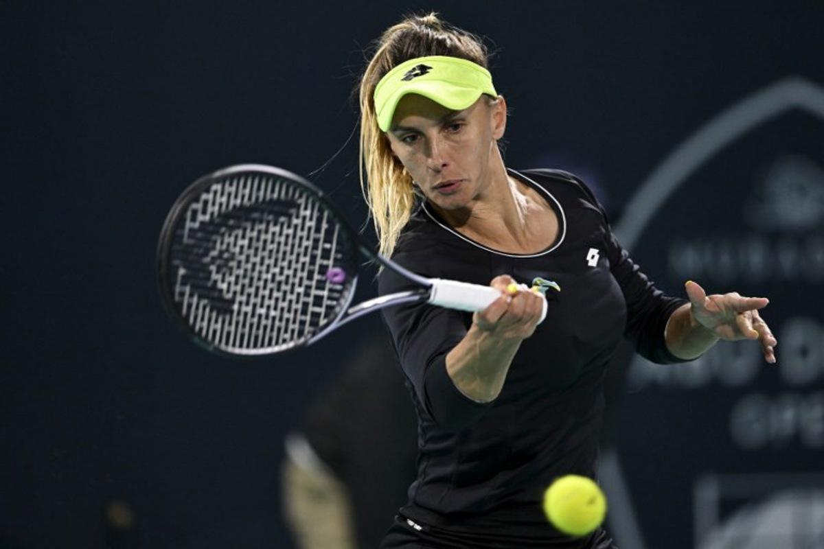 Ukraine's Lesia Tsurenko hits a return against Russia's Liudmila Samsonova during the women's singles match at the Mubadala Abu Dhabi Open tennis tournament in Abu Dhabi on February 6, 2024.  RYAN LIM / AFP