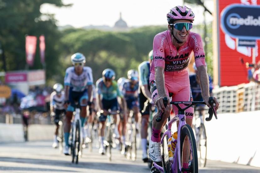 Team Visma-Lease a Bike's British rider Simon Yates wearing the pink jersey of overall leader (Maglia Rosa) celebrates as he crosses the finish line of the 21st and last stage to win the 108th Giro d'Italia cycling race of 143kms from Rome to Rome on June 1, 2025.  Luca Bettini / AFP