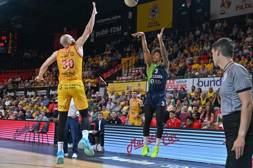 Oostende's Pierre-Antoine Gillet defending on shooting Leiden's Deion Hammond during a basketball match between Belgian BC Oostende and Dutch team ZZ Leiden, Friday 09 June 2023 in Oostende, the first match in the best-of-three finals of the 'BNXT League' basket championship. BELGA PHOTO DAVID CATRY