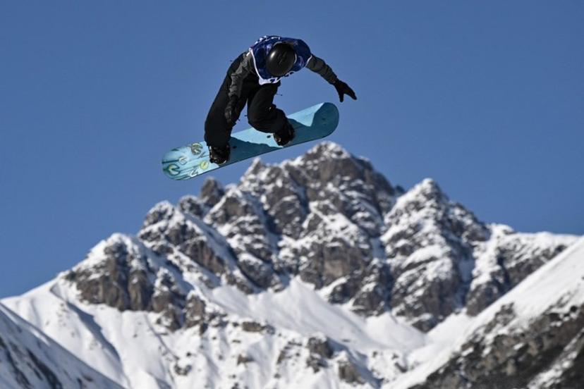Belgium's Sky Remans competes in the snowboard women's slopestyle qualification run 1 during the Milano Cortina 2026 Winter Olympic Games at Livigno Snow Park, in Livigno (Valtellina), on February 15, 2026.  Jeff PACHOUD / AFP