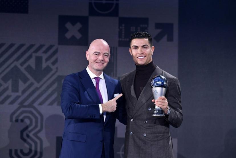 FIFA President Gianni Infantino presents the FIFA Special Best Men's award to Portuguese striker Cristiano Ronaldo (R) during the Best FIFA Football Awards 2021 in Zurich on January 17, 2022.    Harold Cunningham / POOL / AFP