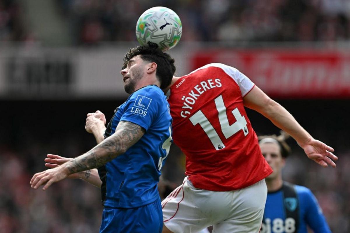 Bournemouth's Argentinian defender #05 Marcos Senesi (L) clashes with Arsenal's Swedish striker #14 Viktor Gyokeres (R) during the English Premier League football match between Arsenal and Bournemouth at the Emirates Stadium in London on April 11, 2026.   Glyn KIRK / AFP