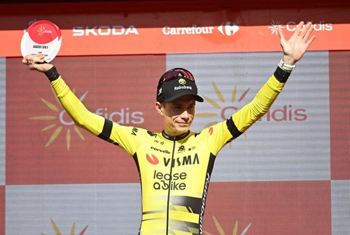 Team Visma-Lease a bike's Danish rider Jonas Vingegaard celebrates on stage after winning the 9th stage of the Vuelta a Espana, a 195 km race between Alfaro and Valdezcaray, on August 31, 2025.    ANDER GILLENEA / AFP
