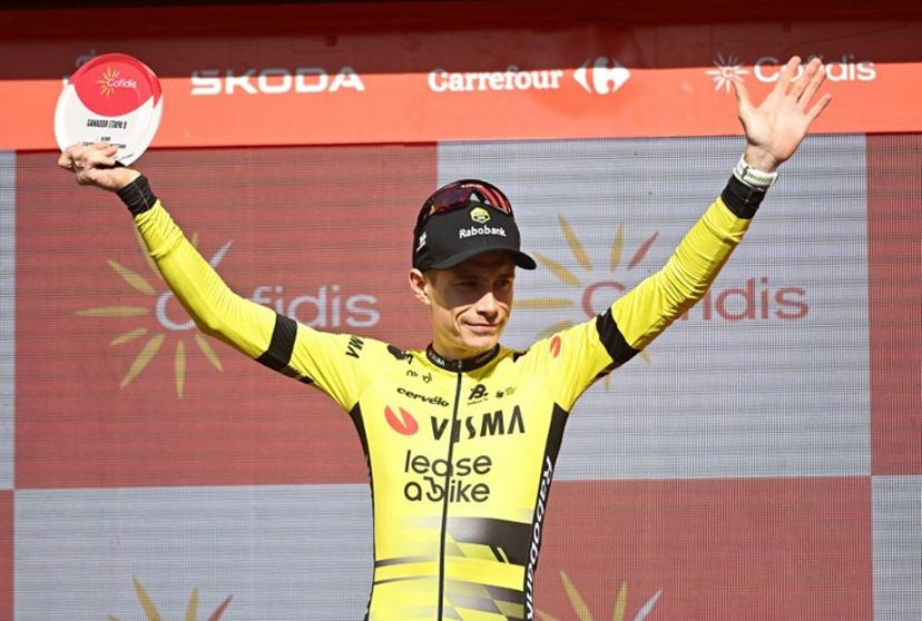 Team Visma-Lease a bike's Danish rider Jonas Vingegaard celebrates on stage after winning the 9th stage of the Vuelta a Espana, a 195 km race between Alfaro and Valdezcaray, on August 31, 2025.    ANDER GILLENEA / AFP