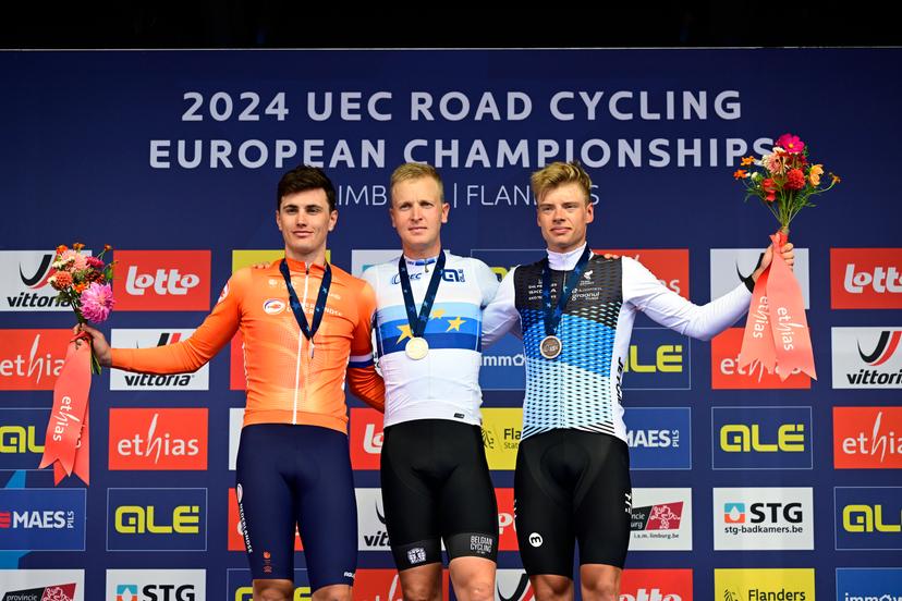 L-R, second Dutch Olav Kooij, Europen champion Belgian Tim Merlier and Estonian Madis Mihkels celebrate on the podium at the Men's Elite Road Race at the European Championship 2024, in Hasselt, Sunday 15 September 2024. The UEC Road European Championships 2024 will take place from 11 to 15 september in Limburg, Belgium. BELGA PHOTO DIRK WAEM