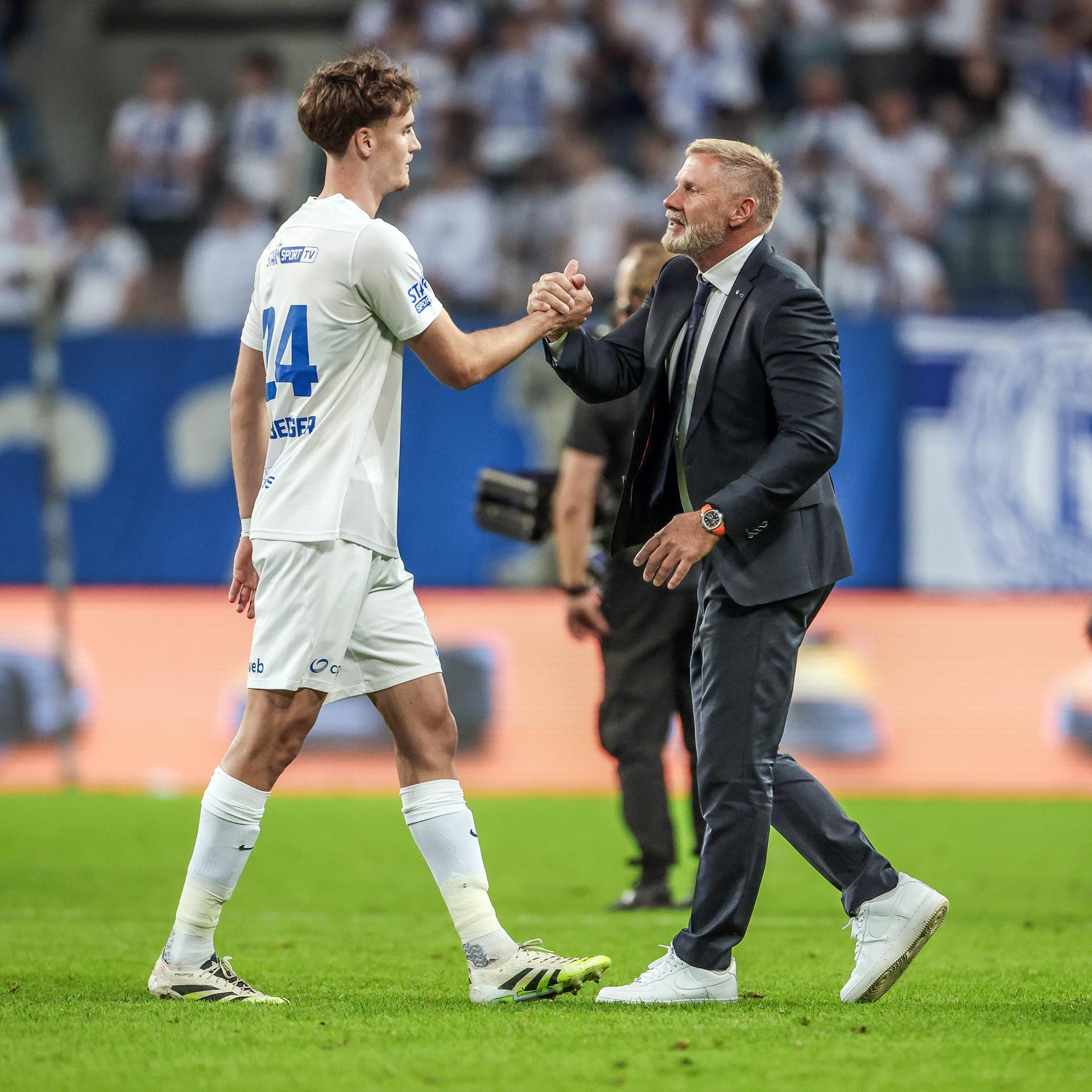 Genk's Nikolas Sattlberger and Genk's head coach Thorsten Fink pictured after a game between Poland's Lech Poznan and Belgian soccer team KRC Genk, on Thursday 21 August 2025 in Poznan, Poland. The game is a first leg of the play-off round for the UEFA Europa League competition. BELGA PHOTO JAKUB PIASECKI / CYFRASPORT/ NEWSPIX - POLAND OUT -