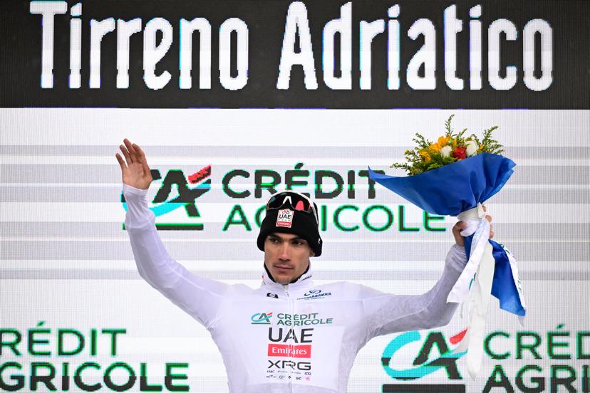 Spanish Juan Ayuso of UAE Team Emirates celebrates on the podium in the white jersey after the third stage of the Tirreno-Adriatico cycling race, a 239km race from Follonica to Colfiorito (Foligno), Italy, Wednesday 12 March 2025. BELGA PHOTO DIRK WAEM