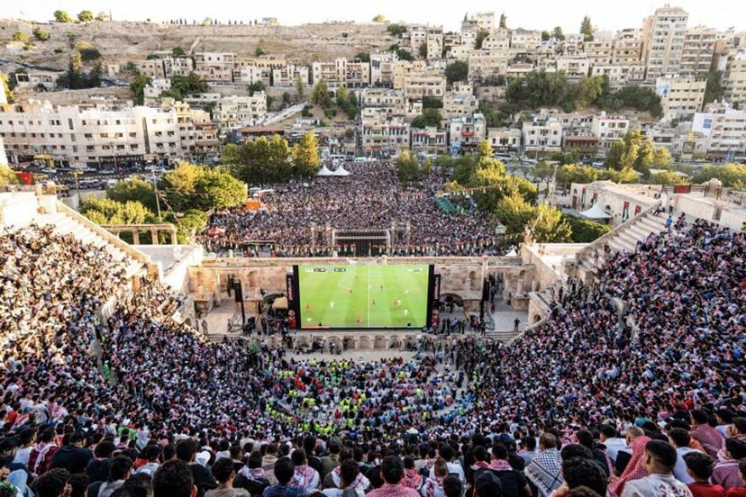Jordanian football fans gather to watch on giant screens their national team's 2026 World Cup Group J football match against Algeria at Amman's 2nd-century Roman amphitheatre early on June 23, 2026.  George SAIF / AFP