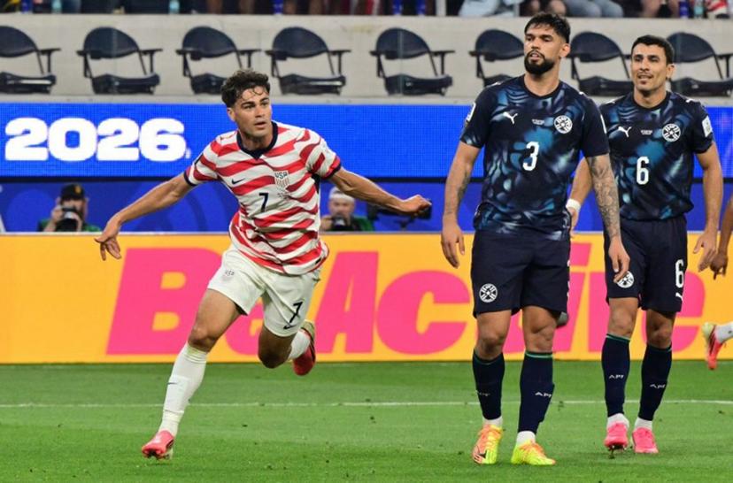 US midfielder #07 Giovanni Reyna celebrates scoring his team's fourth goal during the 2026 World Cup Group D football match between USA and Paraguay at the Los Angeles Stadium in Inglewood on June 12, 2026.  Frederic J. BROWN / AFP