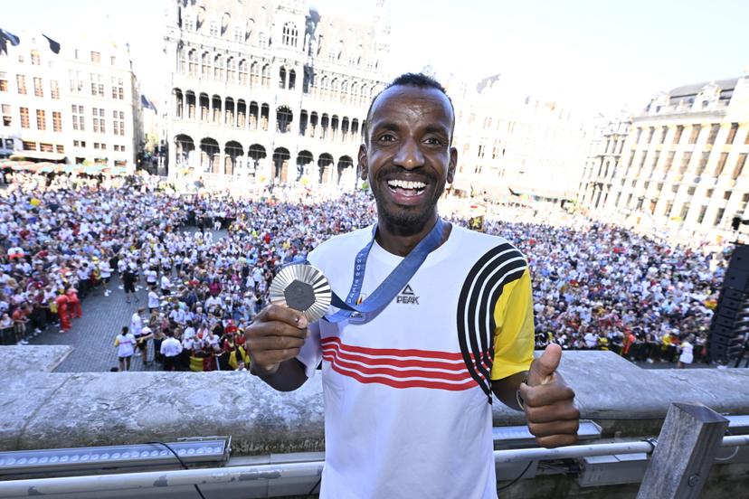 Belgian athlete Bashir Abdi poses with his silver medal during celebrations after the Paris 2024 Olympic Games, at the Grand Place - Grote Markt and the Brussels City Hall, in Brussels, on Monday 12 August 2024. The Belgian delegation at the Games of the XXXIII Olympiad counted 165 athletes competing in 21 sports. BELGA PHOTO ERIC LALMAND