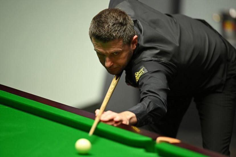 England's Mark Selby plays a shot against Belgium's Luca Brecel during the afternoon session on day two of their World Championship Snooker final match at The Crucible in Sheffield, northern England on May 1, 2023.   Oli SCARFF / AFP