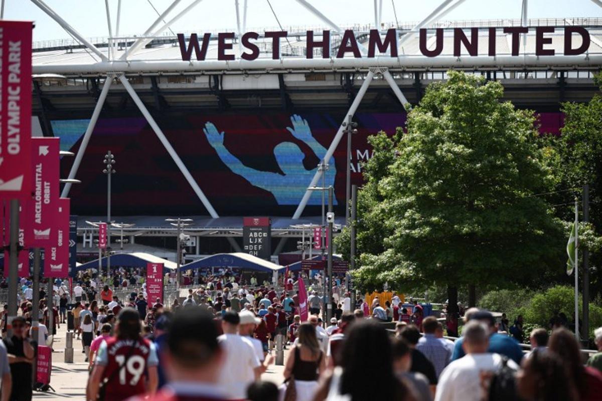 West Ham fans arrive for the English Premier League football match between West Ham United and Leeds United at the London Stadium, in east London on May 24, 2026.  Henry Nicholls / AFP