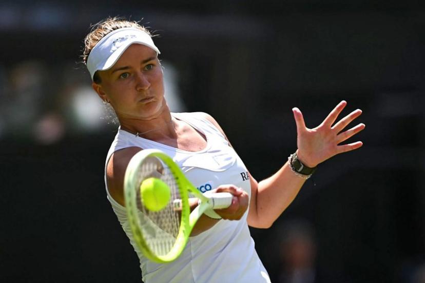 Czech Republic's Barbora Krejcikova plays a forehand return to Philippines' Alexandra Eala during their women's singles first round tennis match on the second day of the 2025 Wimbledon Championships at The All England Lawn Tennis and Croquet Club in Wimbledon, southwest London, on July 1, 2025.  Glyn KIRK / AFP