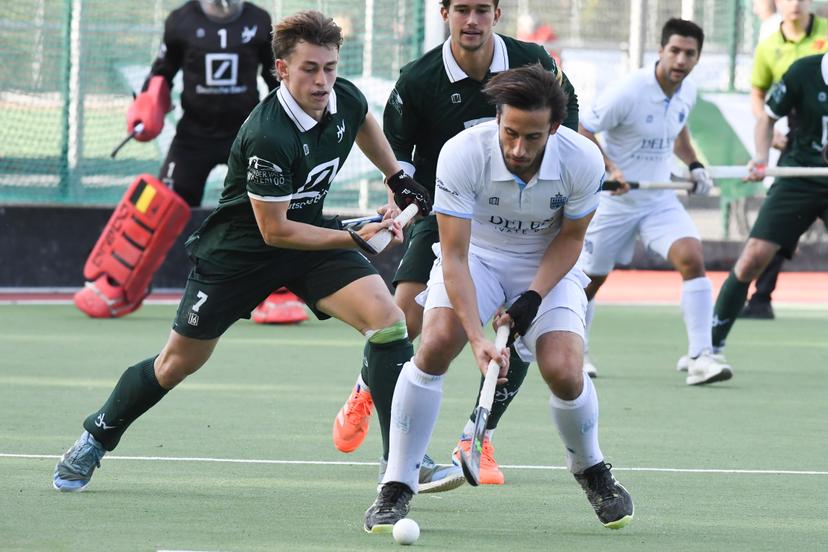 WatDucks' Guillaume Van Marcke and Oree's Charles Masson pictured in action during a hockey game between Waterloo Ducks and Oree, Sunday 12 October 2025 in Waterloo, on day 7 of the Belgian Men Hockey League season 2025-2026. BELGA PHOTO JILL DELSAUX