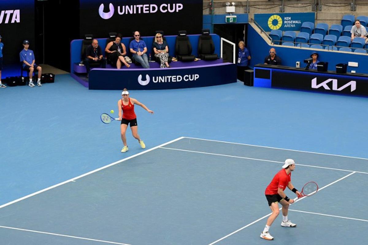 Belgium's Elise Mertens (L) and Zizou Bergs hit a return to Canada's Cleeve Harper and Victoria Mboko during their mixed doubles match at the United Cup tennis tournament on Ken Rosewall Arena, Sydney on January 6, 2026.  Izhar KHAN / AFP