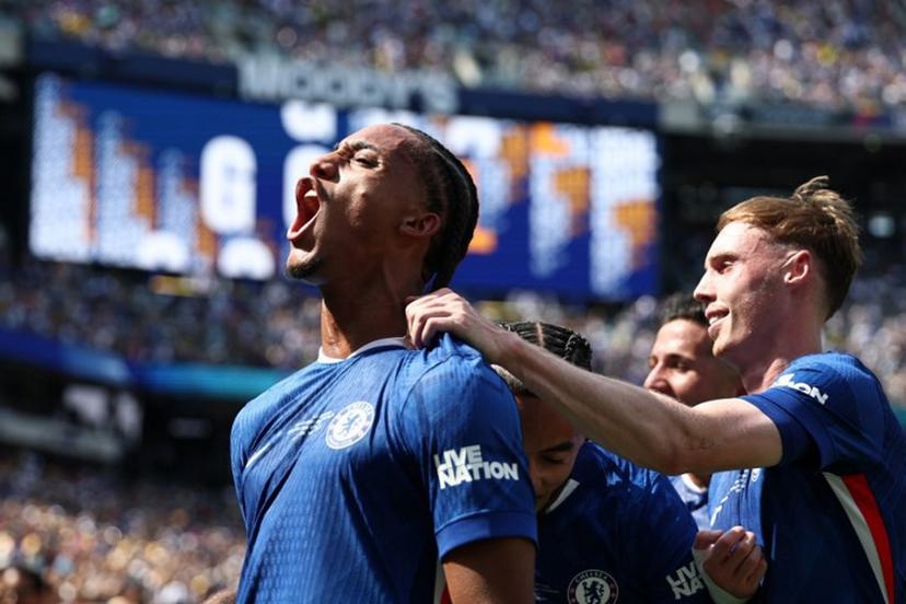 Chelsea's Brazilian forward #20 Joao Pedro (L) celebrates scoring his team's third goal with Chelsea's English midfielder #10 Cole Palmer during the FIFA Club World Cup 2025 final football match between England's Chelsea and France's Paris Saint-Germain at the MetLife Stadium in East Rutherford, New Jersey on July 13, 2025.  FRANCK FIFE / AFP