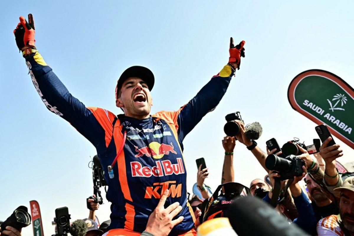 Argentine rider Luciano Benavides with a Ktm 450 Rally Factory celebrates after winning the 48th edition of the Dakar Rally 2026 in Yanbu, Saudi Arabia, on January 17, 2026.  Giuseppe CACACE / AFP