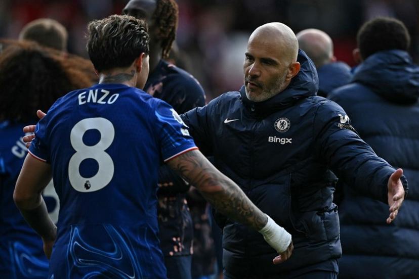 Chelsea's Italian head coach Enzo Maresca hugs Chelsea's Argentinian midfielder #08 Enzo Fernandez after the English Premier League football match between Nottingham Forest and Chelsea at The City Ground in Nottingham, central England, on May 25, 2025. Brighton won the match 4-1. Ben STANSALL / AFP